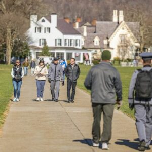 Parents walking with their Plebe cadets at West Point during Plebe Parent Weekend.